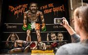 24 August 2017; Whitney Baillie, from Syracuse, New York, takes a photo of a mural of Conor McGregor and Floyd Mayweather outside Sin Nightclub on Sycamore Street in the Temple Bar district of Dublin, Ireland prior to the super welterweight boxing match between Floyd Mayweather Jr and Conor McGregor at T-Mobile Arena in Las Vegas, USA, on Saturday August 26. Photo by Cody Glenn/Sportsfile