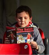25 August 2017; St. Patrick's Athletic supporter Liam Huston, age 6, reads the match programme before the Irish Daily Mail FAI Cup Second Round match between St. Patrick's Athletic and Galway United at Richmond Park, in Dublin. Photo by Matt Browne/Sportsfile
