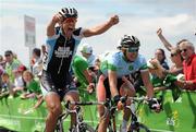 23 May 2012; Mark Sehested Pedersen, Denmark Blue Water Cycling, celebrates winning the fourth stage of the 2012 An Post Rás, into Bundoran, Co. Donegal, from second place Marcin Bialoblocki, Britain Node4 Giordana. Westport - Bundoran. Picture credit: Stephen McCarthy / SPORTSFILE