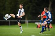 26 August 2017; David McMillan of Dundalk in action against Gary Murphy of Crumlin United  during the Irish Daily Mail FAI Cup Second Round match between Crumlin United and Dundalk at Iveagh Grounds in Drimnagh, Dublin. Photo by Cody Glenn/Sportsfile