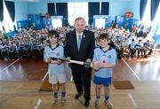 24 May 2012; Jamie Weinmann and Cillian Guinan present Uachtarán Chumann Lúthchleas Gael Liam Ó Néill with a hurley at the Féile na nGael School visit to Scoil Mhuire Marino. Scoil Mhuire CBS, Griffith Avenue, Dublin. Picture credit: Matt Browne / SPORTSFILE