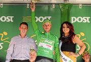 2 May 2012; Gediminas Bagdonas, An Post Sean Kelly team, is presented with his An Post points leader green jersey by Christian McGinley, An Post, Buncrana, and Miss An Post Rás Buncrana Lisa McLaughlin following the third stage of the 2012 An Post Rás, into Westport, Co. Mayo. Gort - Westport. Picture credit: Stephen McCarthy / SPORTSFILE