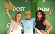 24 May 2012; Martin Hunal, AC Sparta Praha, is presented with the One Direct stage winners jersey by Louise Rohan, One Direct Business Development Executive, and Miss An Post Rás Buncrana Lisa McLaughlin following the fifth stage of the 2012 An Post Rás. Bundoran - Buncrana. Picture credit: Stephen McCarthy / SPORTSFILE