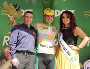 24 May 2012; Stage winner Thomas Rostollan, France AVC Aix En Provence, is presented with the One4All King of the Mountains jersey by Terry Spence, One4All Trade Promotions Manager, and Miss An Post Rás Buncrana Lisa McLaughlin following the fifth stage of the 2012 An Post Rás. Bundoran - Buncrana. Picture credit: Stephen McCarthy / SPORTSFILE