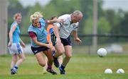 25 May 2012; Referee Keith Delahunty is tackled by Brid Stack, Cork, during a training session ahead of the 2012 TG4/O'Neills Ladies Football All-Star Exhibition game on Saturday. 2012 TG4/O'Neills Ladies All-Star Tour, Centennial Park, Toronto, Canada. Picture credit: Brendan Moran / SPORTSFILE