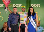 25 May 2012; David Clarke, Node4 Girodana, is presented with the One4All King of the Mountains jersey by Terry Spence, One4All Trade Promotions Manager, and Miss An Post Rás Killybegs Ailbhe Cunningham following the sixth stage of the 2012 An Post Rás. Buncrana - Killybegs. Picture credit: Stephen McCarthy / SPORTSFILE