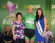 25 May 2012; Gediminas Bagdonas, An Post Sean Kelly team, is presented with his An Post points leader green jersey by Eileen Kennedy, Postmistress, An Post Killybegs, and Miss An Post Rás Killybegs Ailbhe Cunningham following the sixth stage of the 2012 An Post Rás. Buncrana - Killybegs. Picture credit: Stephen McCarthy / SPORTSFILE