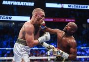 26 August 2017; Floyd Mayweather Jr, right, and Conor McGregor during their super welterweight boxing match at T-Mobile Arena in Las Vegas, USA. Photo by Stephen McCarthy/Sportsfile