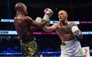 26 August 2017; Conor McGregor, right, and Floyd Mayweather Jr during their super welterweight boxing match at T-Mobile Arena in Las Vegas, USA. Photo by Stephen McCarthy/Sportsfile