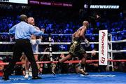 26 August 2017; Referee Robert Byrd separates Floyd Mayweather Jr, right, from Conor McGregor after calling an end to the welterweight boxing match between Floyd Mayweather Jr v Conor McGregor at T-Mobile Arena in Las Vegas, USA. Photo by Stephen McCarthy/Sportsfile