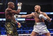26 August 2017; Conor McGregor, right, and Floyd Mayweather Jr during their super welterweight boxing match at T-Mobile Arena in Las Vegas, USA. Photo by Stephen McCarthy/Sportsfile