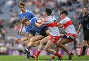 27 August 2017; Seán Hawkshaw of Dublin is tackled by Conor McCluskey, left, and Oran McGill of Derry during the Electric Ireland GAA Football All-Ireland Minor Championship Semi-Final match between Dublin and Derry at Croke Park in Dublin. Photo by Ramsey Cardy/Sportsfile