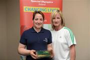 26 May 2012; Kim Byrne, from Wexford, is presented with an FAI International Cap after representing the Republic of Ireland in the 2010 Special Olympics European Games by Olivia O'Toole, herself a Republic of Ireland star, during the 2012 Special Olympics Ireland AGM. Red Cow Moran Hotel, Naas Road, Dublin. Picture credit: Ray McManus / SPORTSFILE