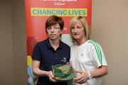 26 May 2012; Nicola McIntyre, from Strabane, Co. Tyrone, is presented with an FAI International Cap after representing the Republic of Ireland in the 2010 Special Olympics European Games by Olivia O'Toole, herself a Republic of Ireland star, during the 2012 Special Olympics Ireland AGM. Red Cow Moran Hotel, Naas Road, Dublin. Picture credit: Ray McManus / SPORTSFILE