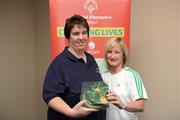 26 May 2012; Linda Cannon, from Athenry, Co Galway, is presented with an FAI International Cap after representing the Republic of Ireland in the 2010 Special Olympics European Games by Olivia O'Toole, herself a Republic of Ireland star, during the 2012 Special Olympics Ireland AGM. Red Cow Moran Hotel, Naas Road, Dublin. Picture credit: Ray McManus / SPORTSFILE