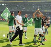 26 May 2012; Republic of Ireland squad members John O'Shea and Darron Gibson during a lap of honour with Three ‘Come on Ireland’ flags to thank the fans in advance for their support in the coming weeks. Republic of Ireland v Bosnia & Herzegovina, Aviva Stadium, Lansdowne Road, Dublin. Picture credit: David Maher / SPORTSFILE