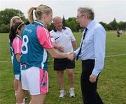 26 May 2012; Dr. Ray Bassett, Irish Ambassador to Canada, is greeted by Juliet Murphy, Cork and captain of the 2011 All Stars, before the game. 2012 TG4/O'Neills Ladies All-Star Tour Exhibition Game, 2010 All Stars v 2011 All Stars, Centennial Park, Toronto, Canada. Picture credit: Brendan Moran / SPORTSFILE