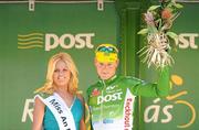 26 May 2012; Third on the stage Sam Bennett, An Post Sean Kelly team, with Miss An Post Rás Cootehill Marie Langan following the seventh stage of the 2012 An Post Rás. Donegal - Cootehill. Picture credit: Stephen McCarthy / SPORTSFILE