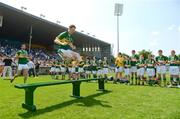 27 May 2012; Colm Cooper, Kerry, jumps over the team bench before the traditional team photograph. Munster GAA Football Senior Championship Quarter-Final, Tipperary v Kerry, Semple Stadium, Thurles, Co. Tipperary. Picture credit: Barry Cregg / SPORTSFILE