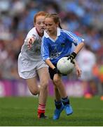 27 August 2017; Maggie Donaghy of Loreto PS, Co Dublin, representing Dublin, in action against Annie McGroddy of Devlinreagh NS, Co Donegal, representing Tyrone, during the INTO Cumann na mBunscol GAA Respect Exhibition Go Games at Dublin v Tyrone - GAA Football All-Ireland Senior Championship Semi-Final at Croke Park in Dublin. Photo by Brendan Moran/Sportsfile