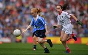 27 August 2017; Orlaith Craven of Ardnagrath NS, Co Westmeath, representing Dublin, in action against Olivia McGuinness of Edendork PS, Co Tyrone, representing Tyrone, during the INTO Cumann na mBunscol GAA Respect Exhibition Go Games at Dublin v Tyrone - GAA Football All-Ireland Senior Championship Semi-Final at Croke Park in Dublin. Photo by Brendan Moran/Sportsfile