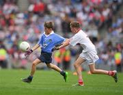 26 August 2017; Callum Clarke of St Coens NS, Co Wicklow, representing Dublin, and Rory Smyth of St Patrick’s PS, Co Fermanagh, representing Tyrone, during the INTO Cumann na mBunscol GAA Respect Exhibition Go Games at Dublin v Tyrone - GAA Football All-Ireland Senior Championship Semi-Final at Croke Park in Dublin. Photo by Ray McManus/Sportsfile