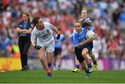 27 August 2017; Meabh Fee of St. Oliver Plunkett NS Co Louth, representing Dublin, in action against Olivia McGuinness of Edendork PS, Co Tyrone, representing Tyrone, during the INTO Cumann na mBunscol GAA Respect Exhibition Go Games at Dublin v Tyrone - GAA Football All-Ireland Senior Championship Semi-Final at Croke Park in Dublin. Photo by Brendan Moran/Sportsfile