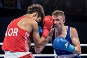 28 August 2017; Brendan Irvine, right, of Ireland exchanges punches with Inkyu Kim of Korea during their flyweight bout at the AIBA World Boxing Championships in Hamburg, Germany. Photo by AIBA via Sportsfile