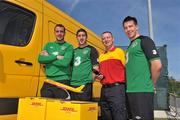 30 May 2012; DHL Express, the world’s leading international express delivery company, continues its commitment to support the logistics needs of the Irish International Soccer Team by delivering more than 16 tons of team and training kit, physio supplies, video analysis and games room equipment in the run up to the Euro 2012 finals. In attendance at the announcement are Republic of Ireland players, from left to right, John O'Shea, Stephen Ward, and Sean St. Ledger with Rodney Moore, DHL Express courier. Gannon Park, Malahide, Co. Dublin. Picture credit: Diarmuid Greene / SPORTSFILE