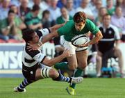 29 May 2012; Conor Murray, Ireland XV, is tackled by Francois Louw, Barbarians. Rugby International, Barbarians v Ireland XV, Kingsholm, Gloucester, England. Picture credit: Matt Impey / SPORTSFILE