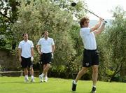 30 May 2012; Republic of Ireland's Stephen Hunt tees off from the 1st hole watched on by Darron Gibson and John O'Shea during a round of golf with members of the Republic of Ireland squad. Republic of Ireland EURO2012 Training Camp, Montecatini Golf Club, Montecatini, Italy. Picture credit: David Maher / SPORTSFILE