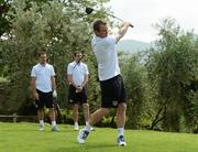 30 May 2012; Republic of Ireland's Glenn Whelan tees off from the 1st hole watched on by Darron Gibson and John O'Shea during a round of golf with members of the Republic of Ireland squad. Republic of Ireland EURO2012 Training Camp, Montecatini Golf Club, Montecatini, Italy. Picture credit: David Maher / SPORTSFILE