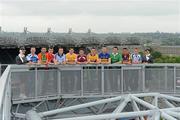 30 May 2012; Etihad Airways, sponsors of the GAA Hurling All-Ireland Senior Championship and the Etihad Skyline, hosted a special Poc Fada competition at Croke Park. The Abu Dhabi-based airline invited 14 hurlers, from the 14 championship counties, to take part in the Poc Fada. Each player was tasked with aiming the sliotar at destinations on a giant map of the Etihad network that was rolled out across the Croke Park pitch. Local charities, nominated beforehand by each player, then received a pair of return tickets to the destination that the sliotar landed on. Pictured are, from left to right, Etihad Cabin Crew member Joanne Fitzpatrick, from Galway City, with  hurlers Patrick Mullaney, Laois, Des Shaw, Carlow, William Egan, Cork, Johnny McCaffrey, Dublin, Shane McNaughton, Antrim, John Shaw, Westmeath, John Conlon, Clare, John O'Brien, Tipperary, Donal O'Grady, Limerick, Keith Rossiter, Wexford, Pauric Mahony, Waterford and Etihad Cabin Crew member Louise Fleury, from Knocklyon, Co. Dublin, in attendance at the event. Croke Park, Dublin. Picture credit: Ray McManus / SPORTSFILE