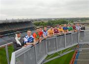 30 May 2012; Etihad Airways, sponsors of the GAA Hurling All-Ireland Senior Championship and the Etihad Skyline, hosted a special Poc Fada competition at Croke Park. The Abu Dhabi-based airline invited 14 hurlers, from the 14 championship counties, to take part in the Poc Fada. Each player was tasked with aiming the sliotar at destinations on a giant map of the Etihad network that was rolled out across the Croke Park pitch. Local charities, nominated beforehand by each player, then received a pair of return tickets to the destination that the sliotar landed on. Pictured are, from left to right, hurlers Patrick Mullaney, Laois, Des Shaw, Carlow, William Egan, Cork, Johnny McCaffrey, Dublin, Shane McNaughton, Antrim, John Shaw, Westmeath, John Conlon, Clare, John O'Brien, Tipperary, Donal O'Grady, Limerick, Keith Rossiter, Wexford and Waterford’s Pauric Mahony in attendance at the event. Croke Park, Dublin. Picture credit: Ray McManus / SPORTSFILE