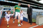 31 May 2012; TV3 presenter Matt Cooper watches as the 2012 GAA Championship Panellists, lead by Kerry footballer Darragh O'Se and TV3 mascots Peter Catterson and Harriet Cantwell, make their way onto the pitch at the TV3 GAA launch 2012. Croke Park, Dublin. Picture credit: Matt Browne / SPORTSFILE
