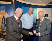29 May 2012; Cyril Freaney is made a presentation by ASJI President Peter Byrne in the company of Dublin Manager Pat Gilroy at a Lucozade Sport / ASJI event to celebrate the victory of the Dublin Football team in the National League Final in 1953. The Croke Park Hotel, Jones's Road, Dublin. Picture credit: Ray McManus / SPORTSFILE