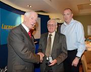 29 May 2012; Norman Allen is made a presentation by ASJI President Peter Byrne in the company of Dublin Manager Pat Gilroy at a Lucozade Sport / ASJI event to celebrate the victory of the Dublin Football team in the National League Final in 1953. The Croke Park Hotel, Jones's Road, Dublin. Picture credit: Ray McManus / SPORTSFILE
