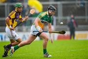 2 June 2012; Shane Dooley, under pressure from Wexford full back Keith Rossiter, on his way to scoring the opening goal of the game for Offaly. Leinster GAA Hurling Senior Championship Quarter-Final, Offaly v Wexford, O'Connor Park, Tullamore, Co. Offaly. Picture credit: Ray McManus / SPORTSFILE