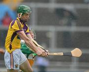 2 June 2012; David Franks, Offaly, tips the sliothar away as Wexford substitute Harry Kehoe attempts a shot on goal. Leinster GAA Hurling Senior Championship Quarter-Final, Offaly v Wexford, O'Connor Park, Tullamore, Co. Offaly. Picture credit: Ray McManus / SPORTSFILE