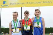 2 June 2012; Gold medal winner Lydia Mills, centre, from Ballyclare High School, Co. Antrim, with second place Jessice McMaster, left, from Belfast High School, Co. Antrim, and third place Kristina Sadovala, right, from, Tullamore College, Co. Offaly, after the Junior Girls Triple Jump at the Aviva All Ireland Schools’ Track and Field Championships 2012. Tullamore Harriers AC, Tullamore, Co. Offaly. Picture credit: Matt Browne / SPORTSFILE