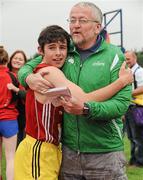 2 June 2012; Eoin Strutt, St. Fintans High School, Sutton, Dublin, is congratulated by former Olympian Pat Hooper after winning the Under 16 Boys 1 mile event at the Aviva All Ireland Schools’ Track and Field Championships 2012. Tullamore Harriers AC, Tullamore, Co. Offaly. Picture credit: Tomas Greally / SPORTSFILE