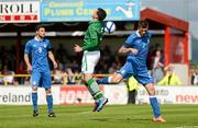 4 June 2012; Greg Cunningham, Republic of Ireland, heads his side's second goal despite the attention of Davide Santon, Italy. UEFA Under-21 Championship 2013 Qualifier, Republic of Ireland v Italy, Showgrounds, Sligo. Picture credit: Stephen McCarthy / SPORTSFILE