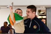 3 September 2017; Joe Ward looks on as his son Jerry, aged 3 lifts up his Silver medal during the Team Ireland return from AIBA World Boxing Championships at Dublin Airport, in Dublin. Photo by Barry Cregg/Sportsfile