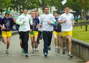 5 June 2012; Boxer Kenneth Egan, former Olympic 5000m silver medallist Sonia O'Sullivan and Cillian Kirwan, from St. Vincent's high School, Sutton, who will be a torch bearer, taking part in the Olympic Dream Run, Howth, Co. Dublin. Photo by Sportsfile