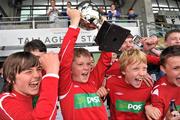 5 June 2012; St. Antony's BNS, Ballinlough, Co. Cork, team captain Dylan Ward lifts the cup as his team-mates celebrate their victory in the &quot;C&quot; Boy's Schools category. An Post FAI Primary Schools 5-a-Side All-Ireland Finals, Tallaght Stadium, Tallaght, Dublin. Picture credit: Barry Cregg / SPORTSFILE