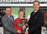 5 June 2012; St. Antony's BNS, Ballinlough, Co. Cork, team captain Dylan Ward with the cup alongside Robbie Moran, left, Vice-Chairperson of FAI Schools and Barney Whelan, Director of Communications and Corperate Affairs with An Post, after his sides victory in the &quot;C&quot; Boy's Schools category. An Post FAI Primary Schools 5-a-Side All-Ireland Finals, Tallaght Stadium, Tallaght, Dublin. Picture credit: Barry Cregg / SPORTSFILE