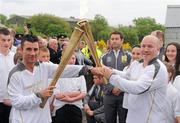 6 June 2012; Medallists in the 1992 Barcelona Olympic Games, Wayne McCullough, left, and Michael Carruth, perform a &quot;torch Kiss&quot; transferring the Olympic Flame during the hand over of the Olympic Torch at the border of Northern Ireland and the Republic of Ireland. Carrickarnon, Co. Louth. Picture credit: Oliver McVeigh / SPORTSFILE