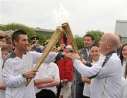 6 June 2012; Medallists in the 1992 Barcelona Olympic Games, Wayne McCullough, left, and Michael Carruth, perform a &quot;torch Kiss&quot; transferring the Olympic Flame during the hand over of the Olympic Torch at the border of Northern Ireland and the Republic of Ireland. Carrickarnon, Co. Louth. Picture credit: Oliver McVeigh / SPORTSFILE