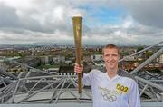 6 June 2012; Kilkenny hurler and 10 time hurling All-Star Henry Shefflin holds up the Olympic Flame over Dublin City Centre, while on the Etihad Skyline at Croke Park, during the London 2012 Olympic Torch Relay in Ireland. Croke Park, Dublin. Picture credit: Brendan Moran / SPORTSFILE