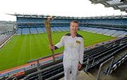6 June 2012; Kilkenny hurler and 10 time hurling All-Star Henry Shefflin in Croke Park with the Olympic Flame during the London 2012 Olympic Torch Relay in Ireland. Croke Park, Dublin. Picture credit: Brendan Moran / SPORTSFILE